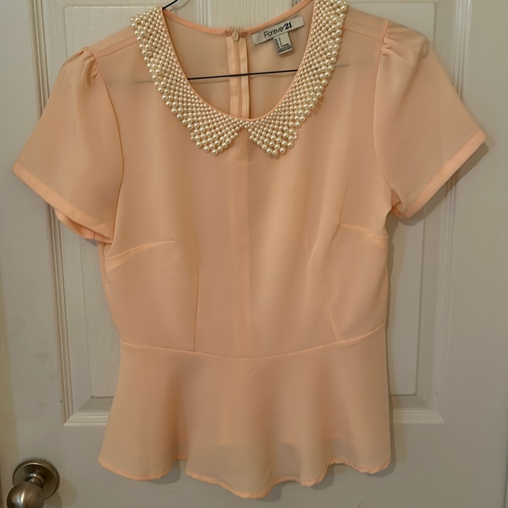 Peach peplum top with pearl collar